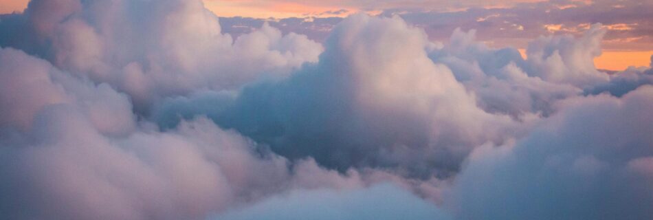 clouds in the sky with purple, cyan and sunset hues.